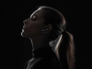 creativeim A girl is wearing wireless earphones